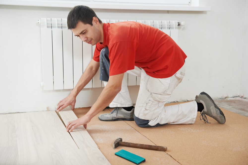 Quelles garanties un artisan vous assure-t-il pour poser votre parquet
